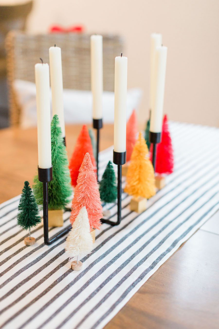 colorful decorative mini christmas trees & tall white candles